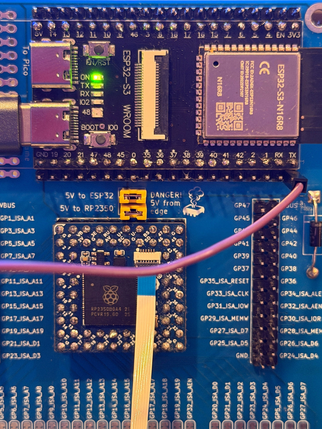 MSX FujiNet board powered up in a Panasonic FS-A1 cartridge slot, ESP32-S3 power LED lit.