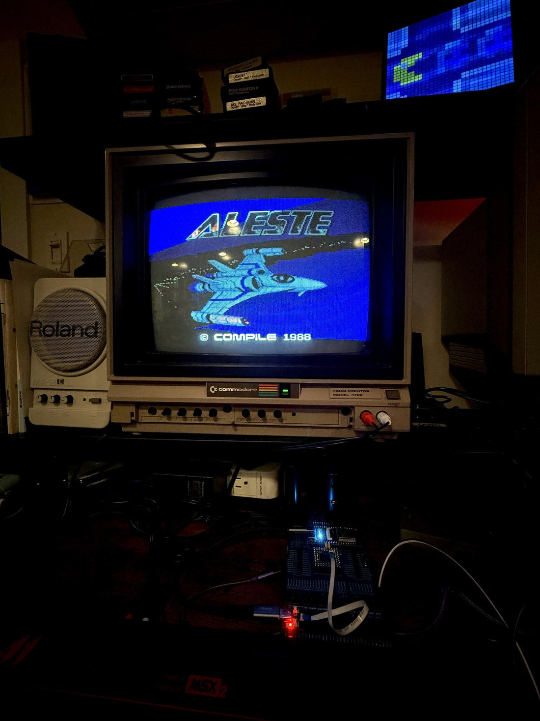Aleste title screen running on a Panasonic FS-A1 over WiFi via FujiNet, the board lit below the monitor.