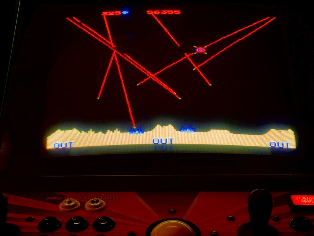 Atari Missile Command on an arcade cabinet, the trackball in the control panel below.