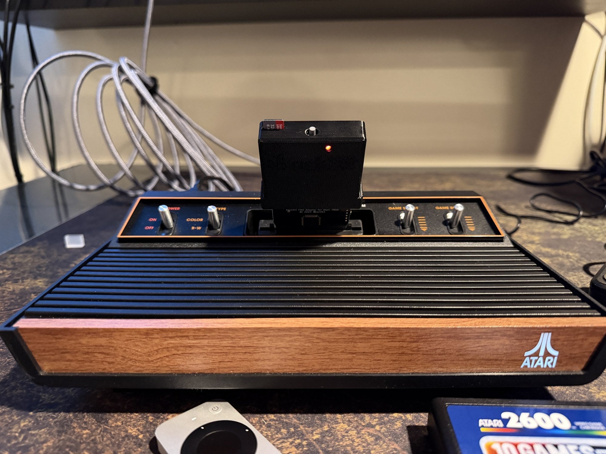 A BackBit Pro flash cart inserted in an Atari 2600+ console.